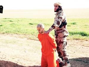 داعش يقتل أحد السجناء السوريين